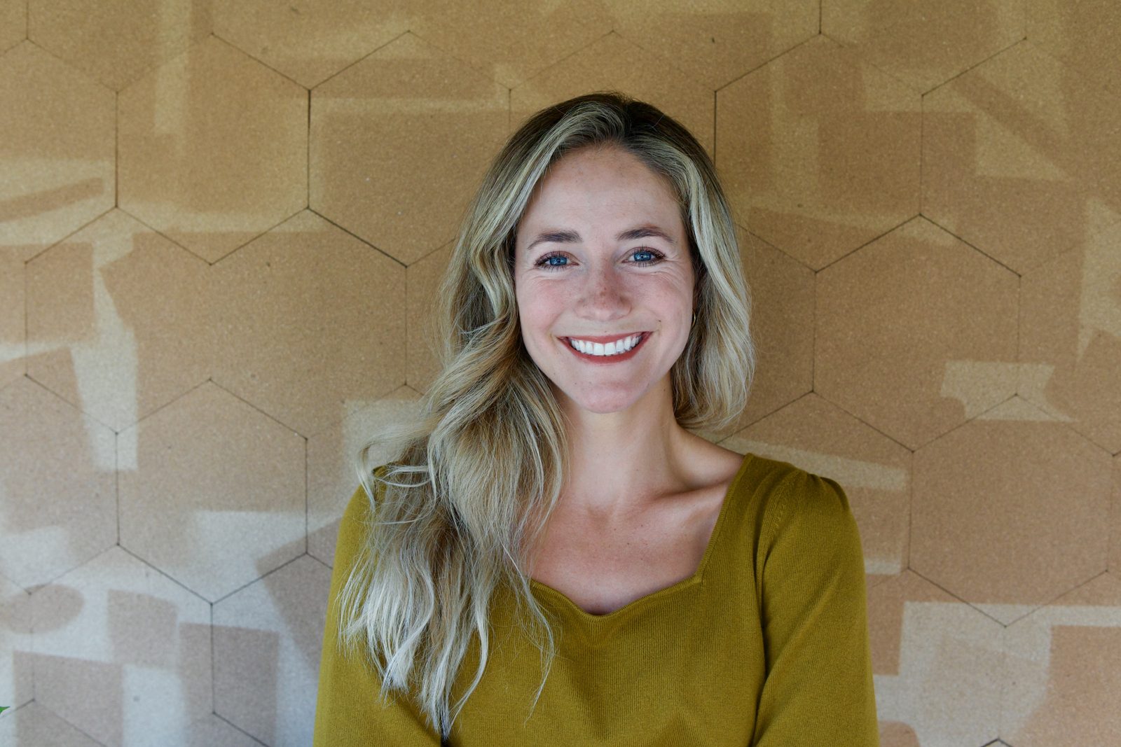 Sky smiling in front of a cork wall
